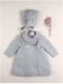 Knitted coat and bonnet with pompoms