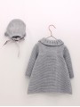 Girl’s knit coat and bonnet